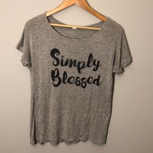 Grey shirt that’s says “Simply Blessed”